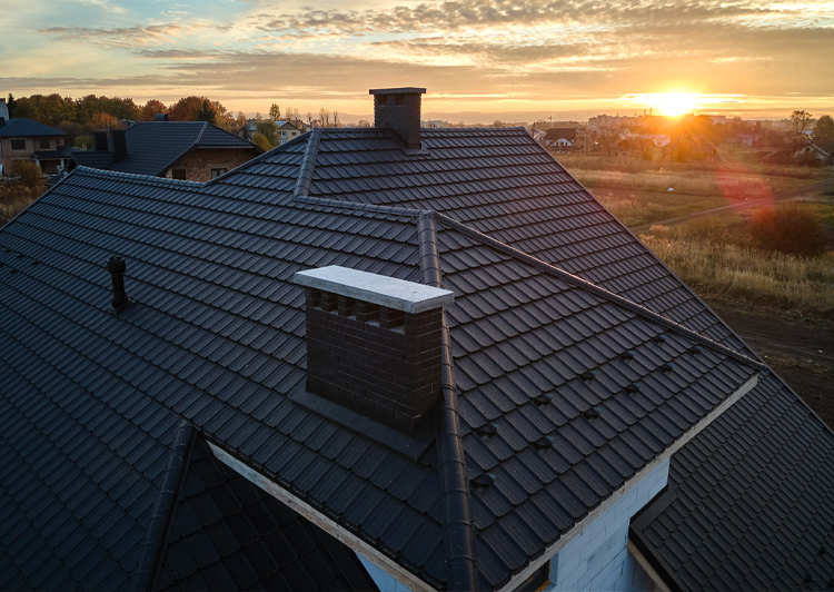 Roof of the house at sunset