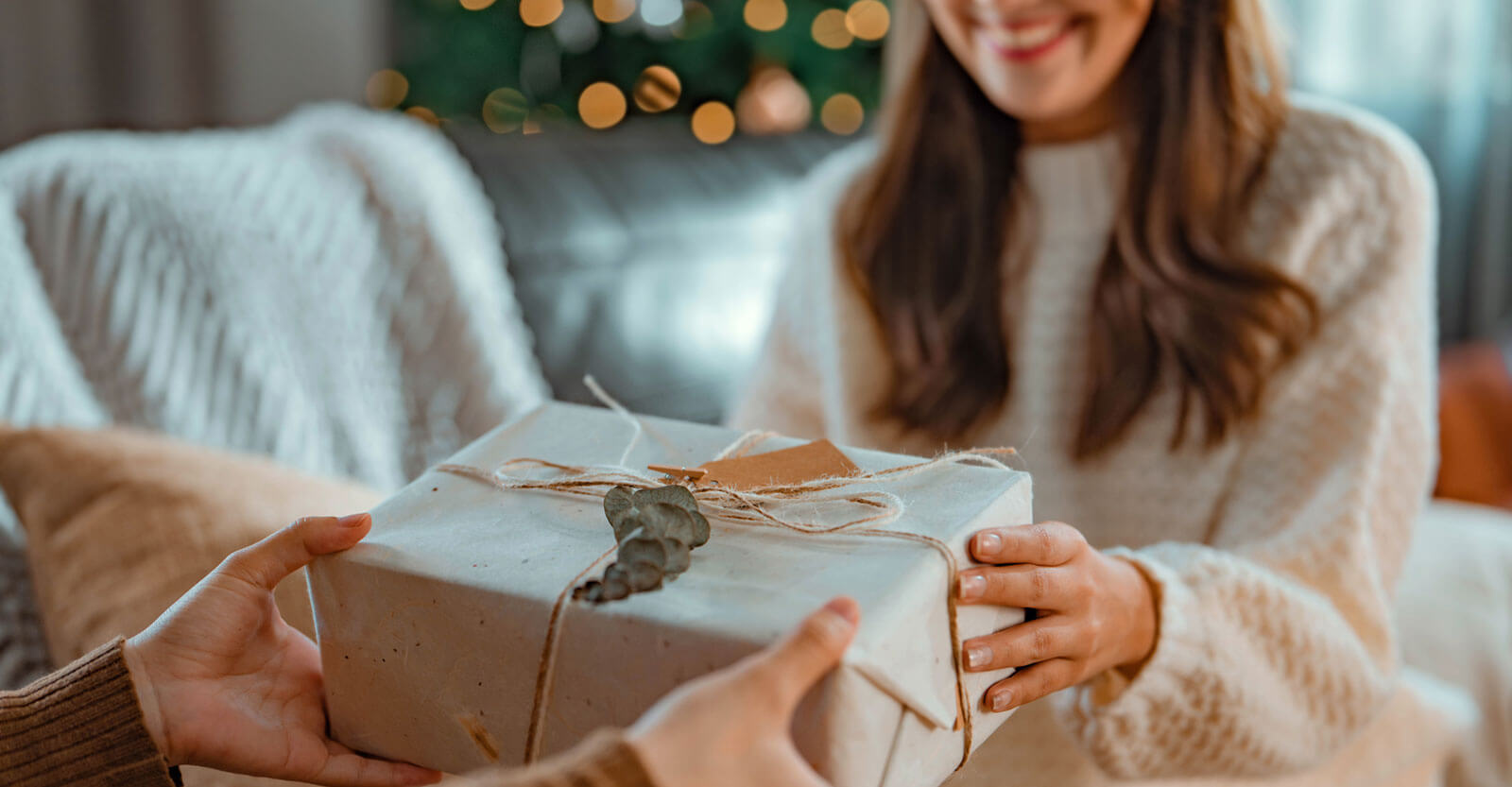 Woman giving a gift to someone