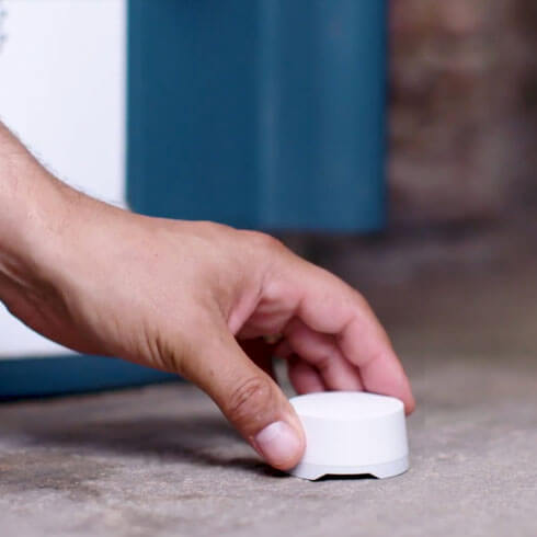 Man holding a water sensor