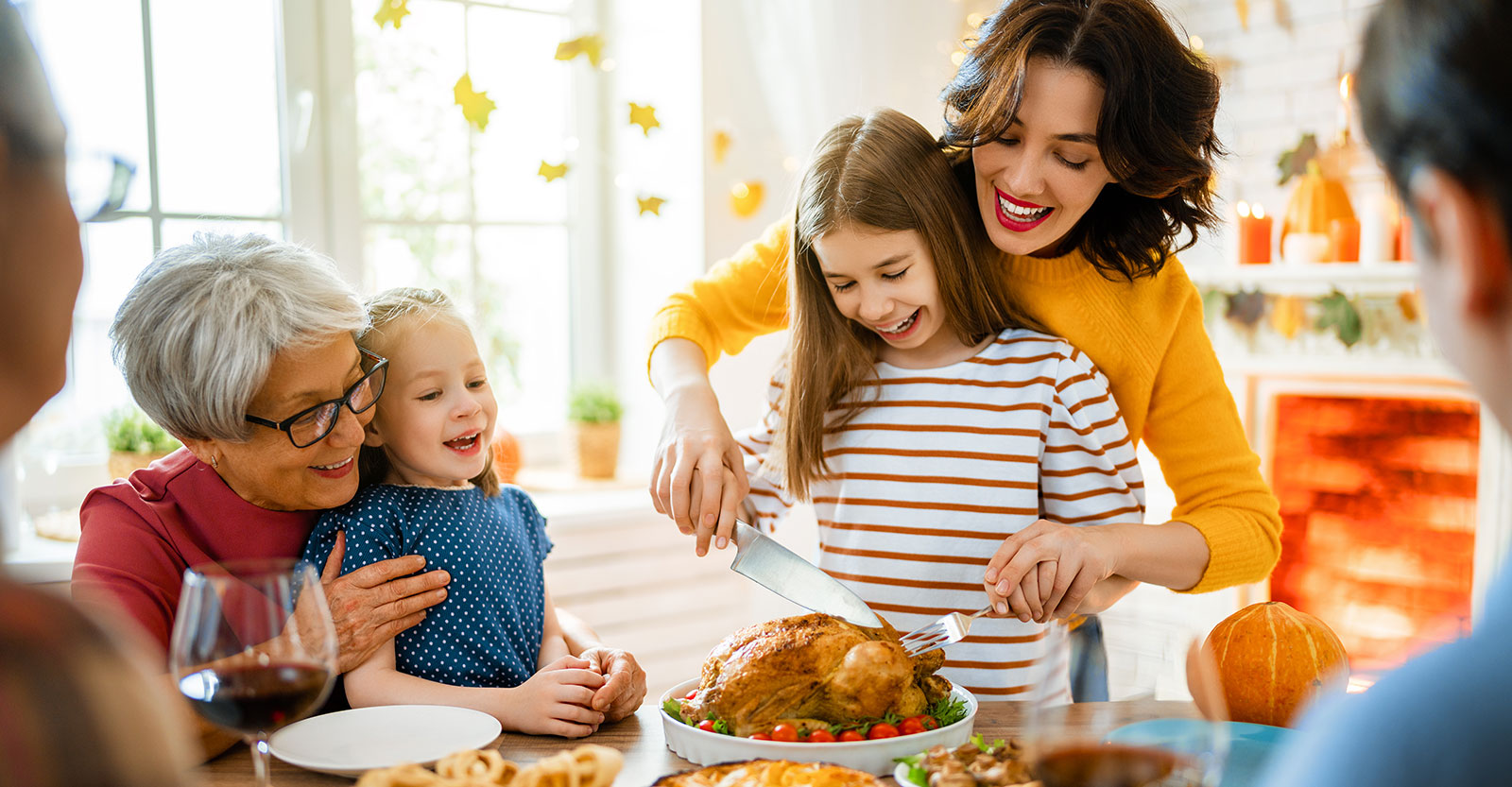 family carving turkey