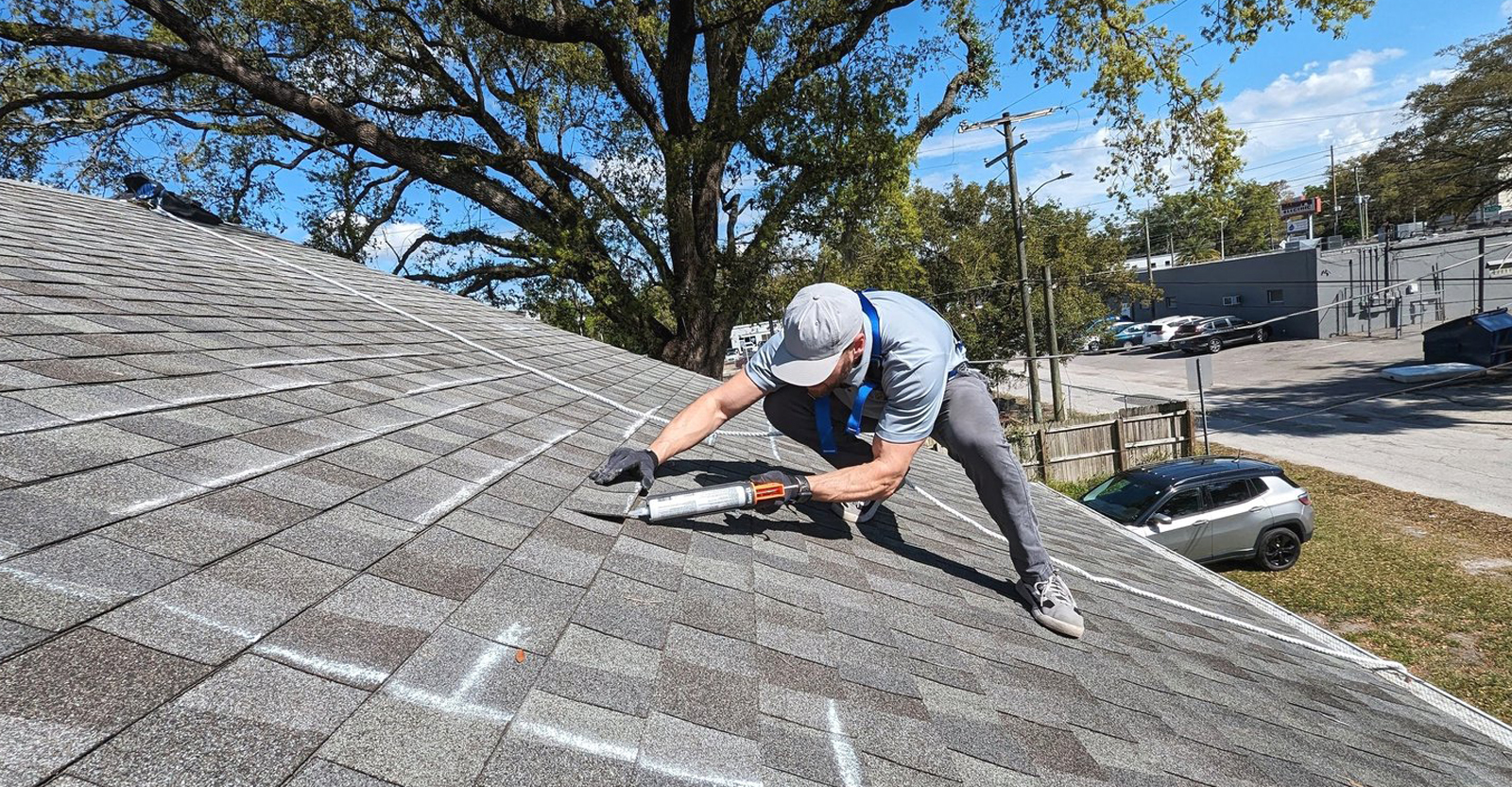 Man repairing roof shingles