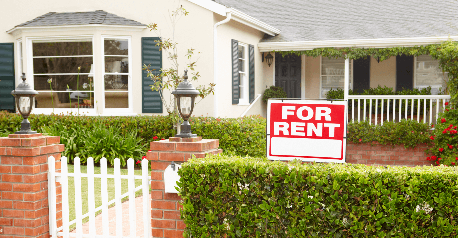 For rent sign in front of a house.
