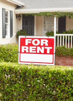 For rent sign in front of a house.