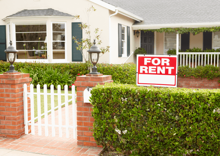 For rent sign in front of a house.